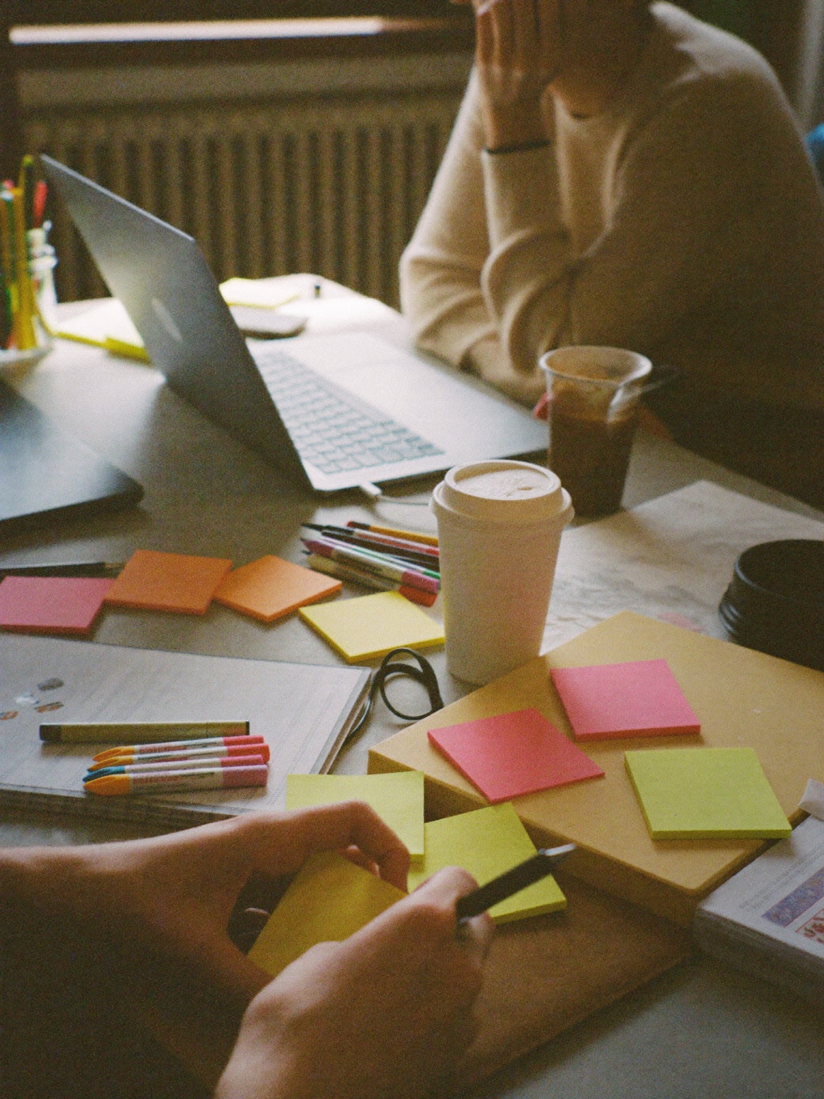 Close-up of a team working through an AI transformation session